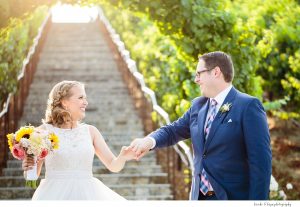 Nella Terra Wedding, bride and groom dancing at the bottom of stairs